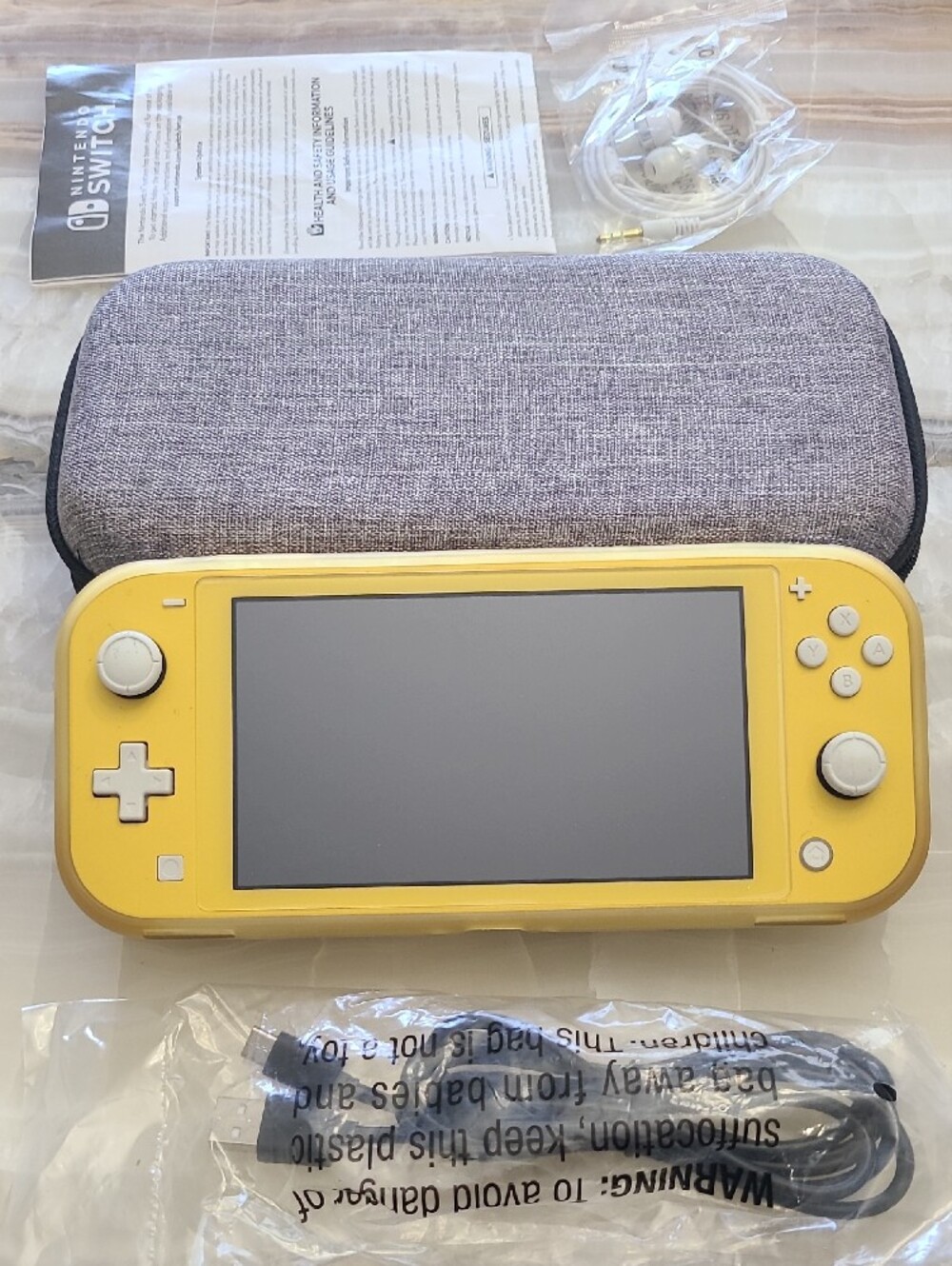 Nintendo Switch Lite Yellow Handheld Console with Gray Carry Case